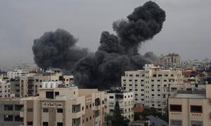 TheTal al-Hawa neighbourhood in Gaza City is hit by a missile strike.