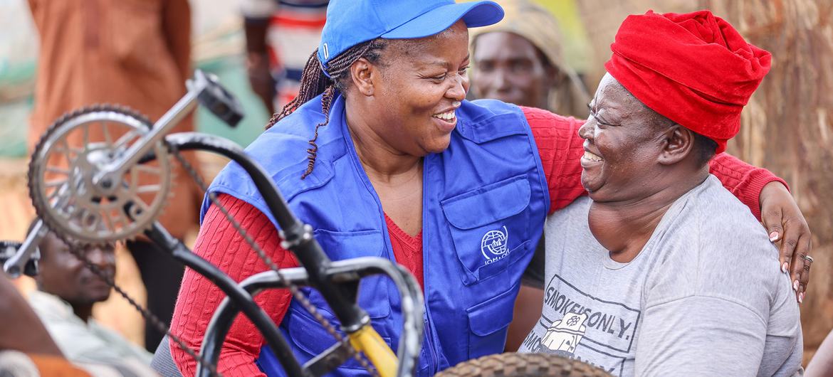 Shiminenge (right) has received support from the IOM and other humanitarian agencies.