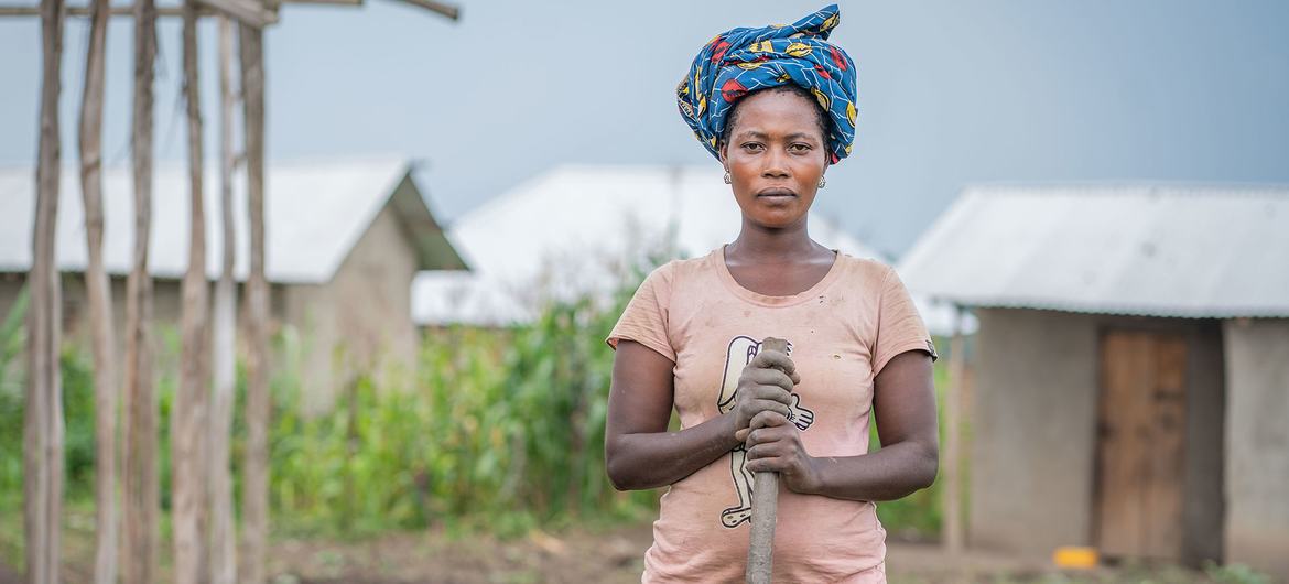 A woman in the eastern DR Congo, who was forced to flee her home, due to violence works on a smallholding. A woman in the eastern DR Congo, who was forced to flee her home, due to violence works on a smallholding.