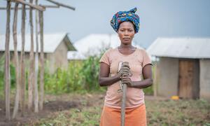 A woman in the eastern DR Congo, who was forced to flee her home, due to violence works on a smallholding.