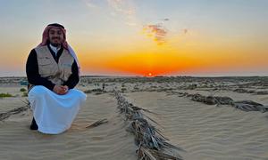 The sun rises over the desert close to the Al Ahsa oasis in eastern Saudi Arabia.