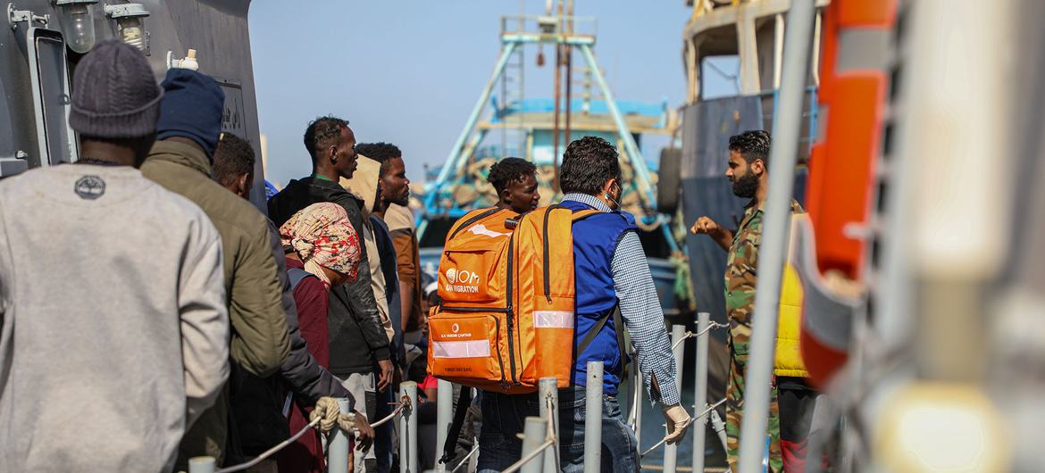 UN teams provide medical assistance to migrants who are disembarking in Abusita port in Tripoli, Libya.