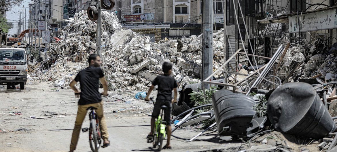 A tower block lies in ruins in Gaza city following an Israeli air strike. 