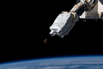The SS-1 satellite being deployed from the International Space Station