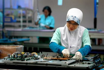 A woman works in an electronics factory in Cikarang, Indonesia.
