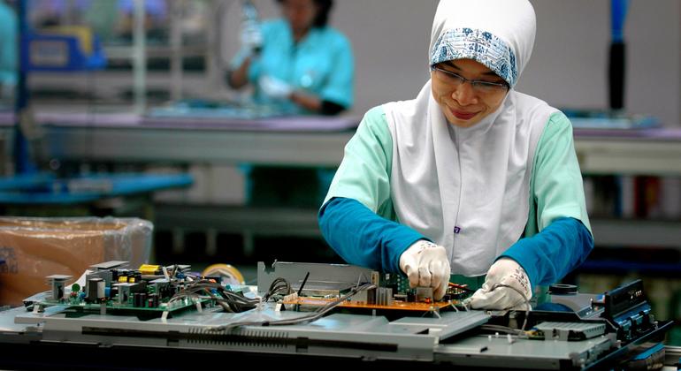 A woman works at an electronics factory in Cikarang, Indonesia.