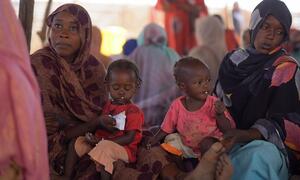 Mothers feed their children with ready-to-use-therapeutic food (RUTF) at a UNICEF-supported nutrition center in Tawila, North Darfur, Sudan, as part of a campaign to screen and treat malnutrition among children under five.