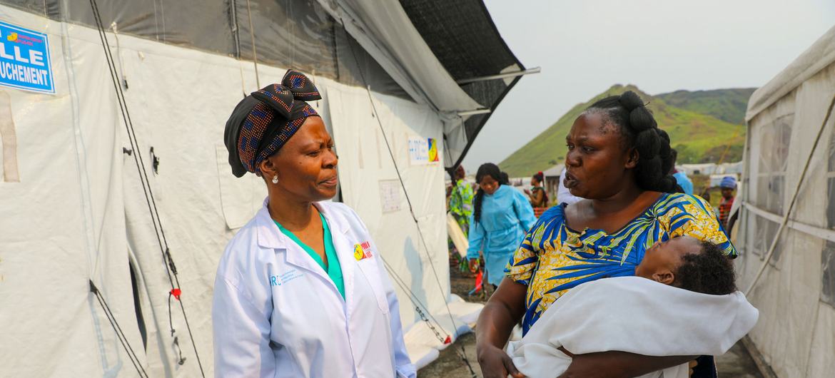 A woman who fled violence in the eastern DR Congo receives post-natal care at a camp for displaced people. A woman who fled violence in the eastern DR Congo receives post-natal care at a camp for displaced people.