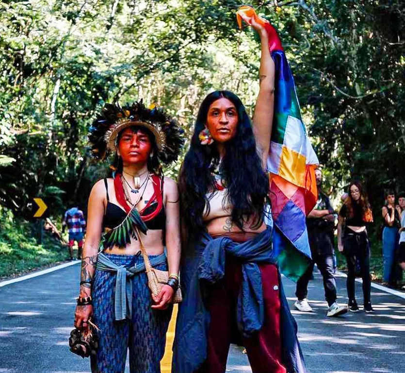 Ms. Flow (right) at a protest by the Guarani people of Brazil.