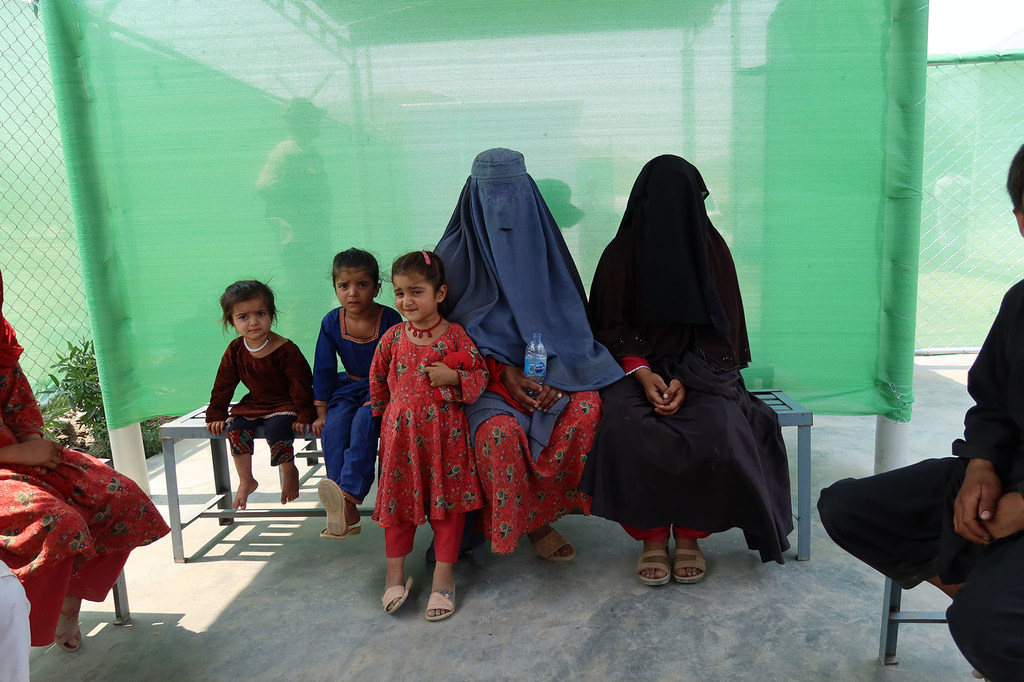 A group of Afghan women and girls returnees at a health clinic. Many face vulnerabilities such as inadequate shelter and limited healthcare access.