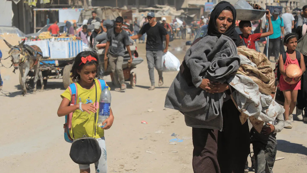 A displaced family leaves the eastern area of Deir Albalah after Israeli authorities issued an evacuation order for the area.