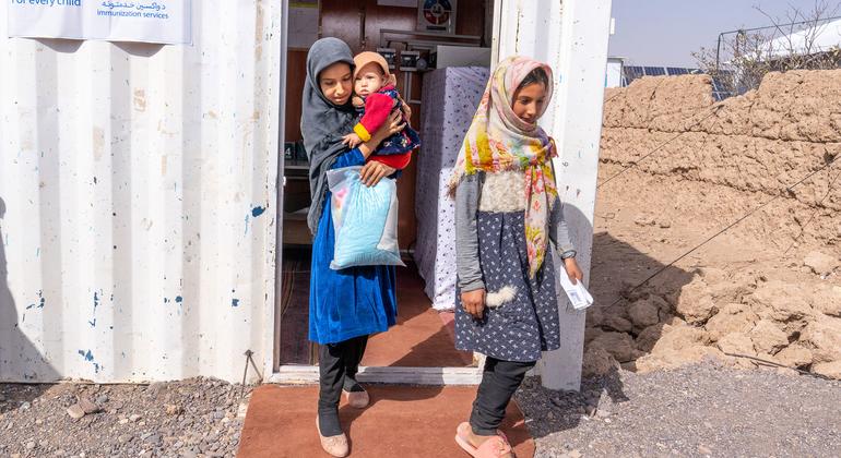 Girls exit a temporary health clinic in Herat province, Afghanistan. Girls exit a temporary health clinic in Herat province, Afghanistan.