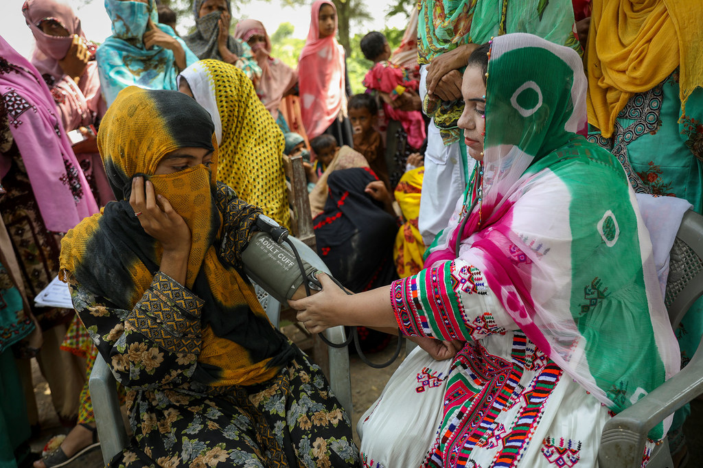 A health worker conducts blood pressure tests in rural India. A health worker conducts blood pressure tests in rural India.