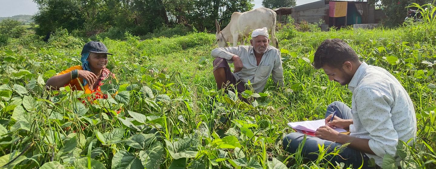 Siddhesh Sakore (right) works with farmers in Pune, India.