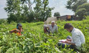 Siddhesh Sakore (right) works with farmers in Pune, India.