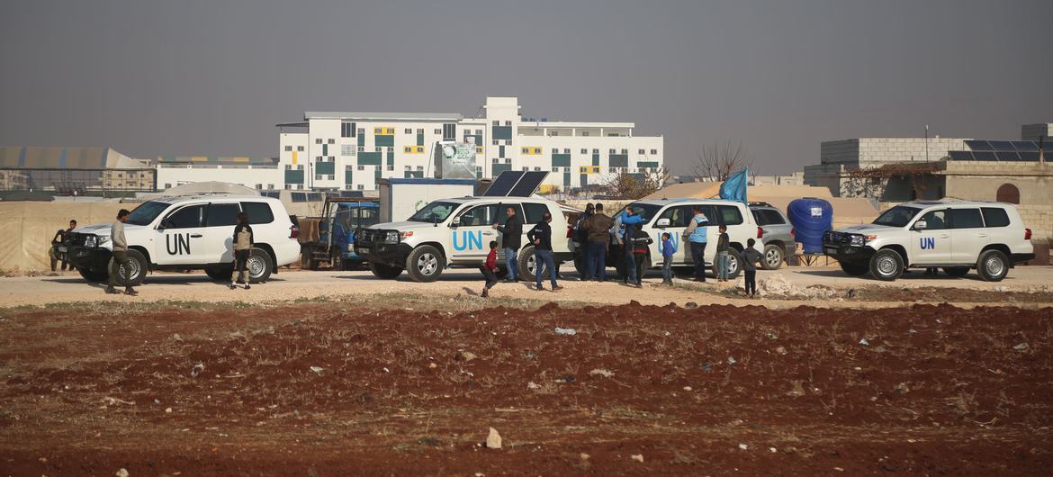 UN vehicles pause during a journey through Aleppo in Syria.