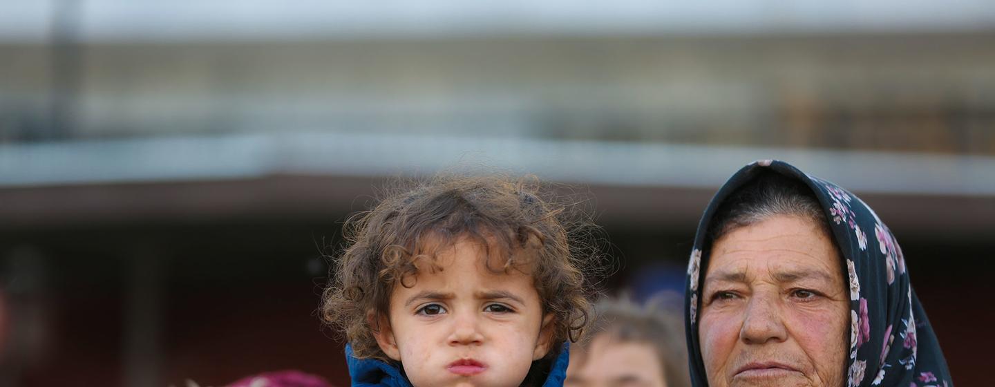 Families arriving at a reception centre in Ar-Raqqa city, Syria, on 4 December 2024