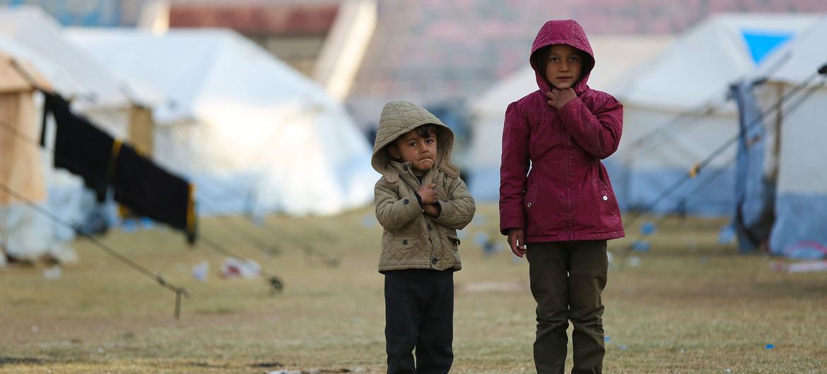 Children stand at a reception centre for newly arrived displaced families in Raqqa city, Syria.