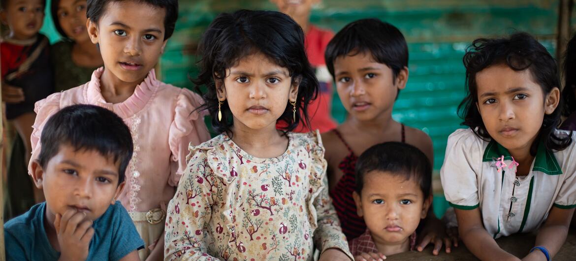 A group of Rohingya refugee children looking at the camera during a visit to a Multi-purpose Centre for Children and Adolescents in a refugee camp in Cox's Bazar.