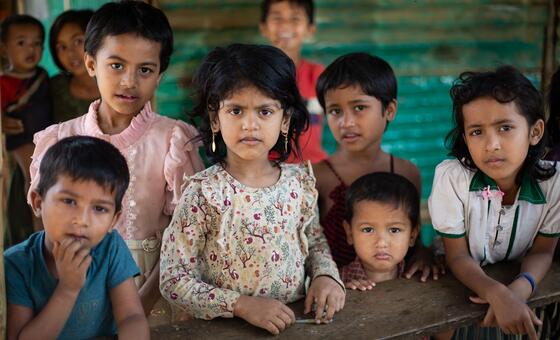 A group of Rohingya refugee children looking at the camera during a visit to a Multi-purpose Centre for Children and Adolescents in a refugee camp in Cox's Bazar.