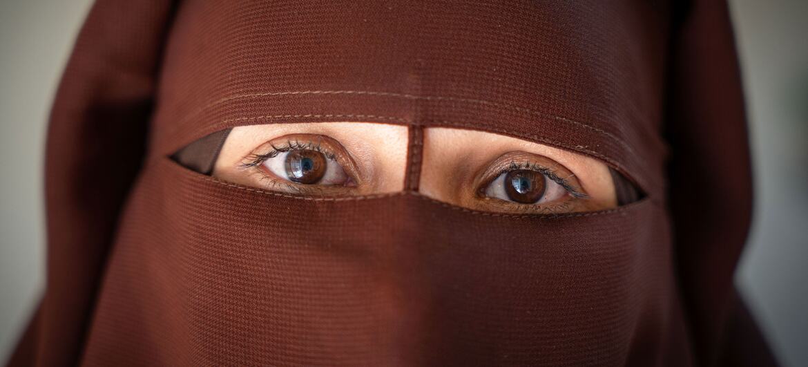 Close-up of a woman wearing a brown niqab in Syria.