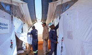 WHO staff and inmates establish an Ebola isolation unit inside a prison in Bunia, Democratic Republic of the Congo.