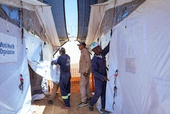 WHO staff and inmates establish an Ebola isolation unit inside a prison in Bunia, Democratic Republic of the Congo.