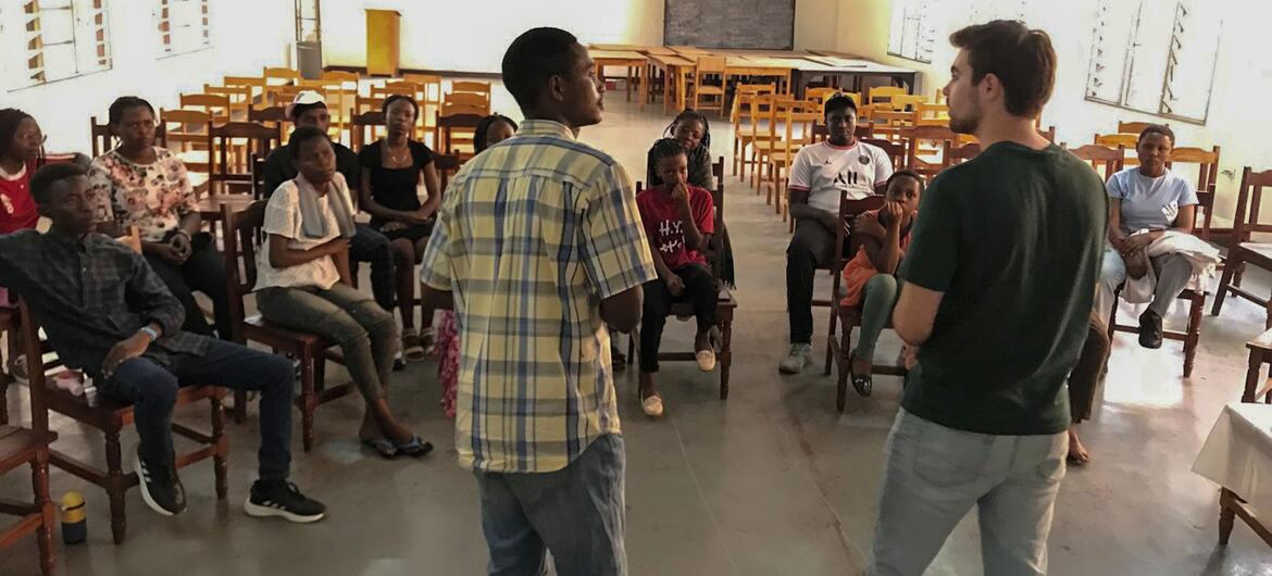A group of young people and facilitators in a classroom in Kigali, Rwanda, participating in a youth consultation.