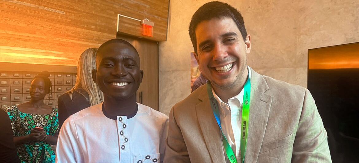 Issah Toha Shamsoo and Felipe Paullier, Assistant Secretary-General for Youth Affairs, stand together and smile.