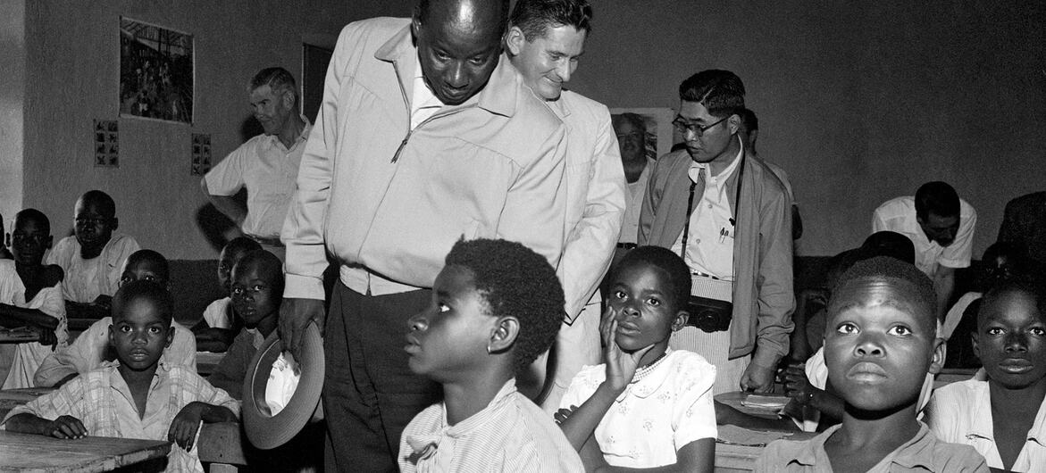 A 1955 UN visiting mission to the French Cameroons observes students in a classroom.