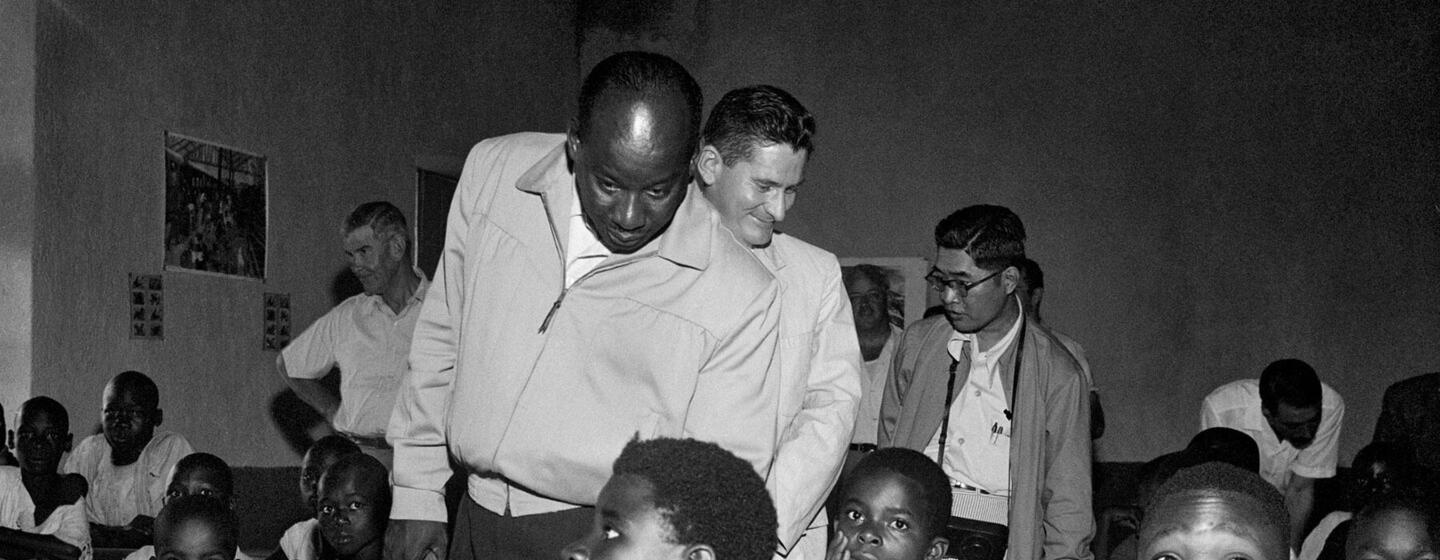 A 1955 UN visiting mission to the French Cameroons observes students in a classroom.