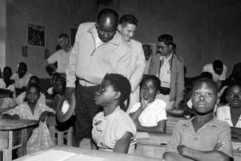 A 1955 UN visiting mission to the French Cameroons observes students in a classroom.