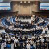 A large group of people posing for a photo in the UN Security Council chamber during the 80th anniversary event of Thailand and the United Nations.