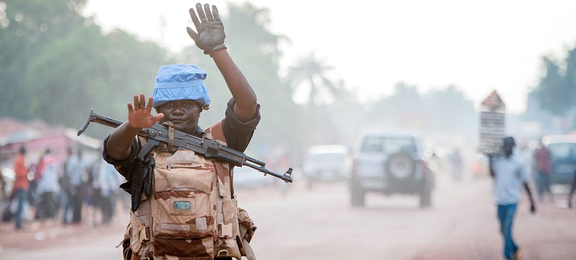 A UN police officer stops a vehicle at a checkpoint in Bangui, the Central African Republic.