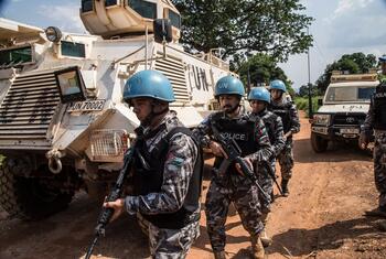 UN peacekeepers from Jordan stand guard next to armored vehicles in the Central African Republic.