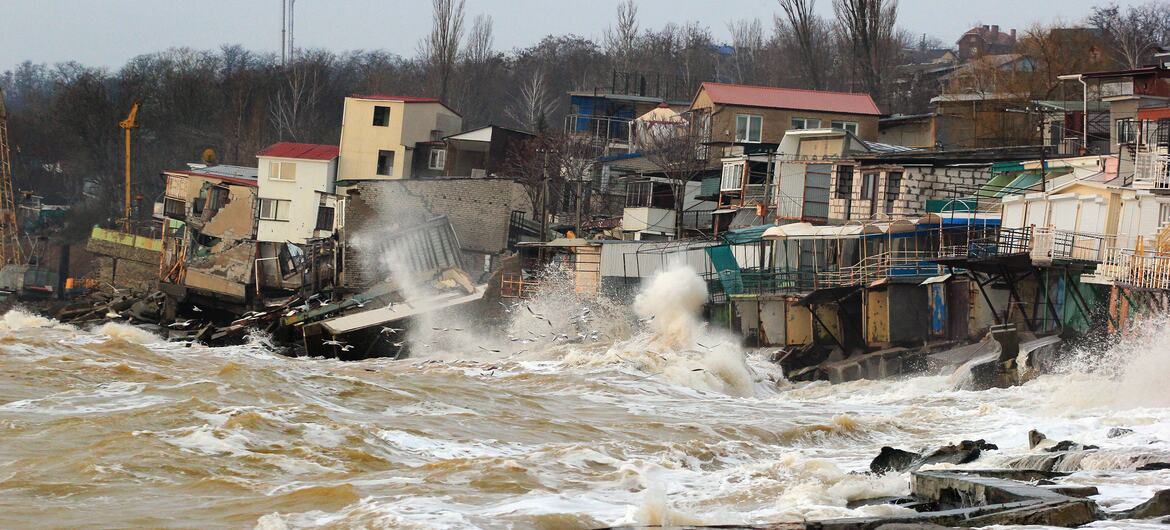 Stormy waves crash against a crumbling shoreline in Odessa, Ukraine, causing houses built on weak soil to collapse into the sea.