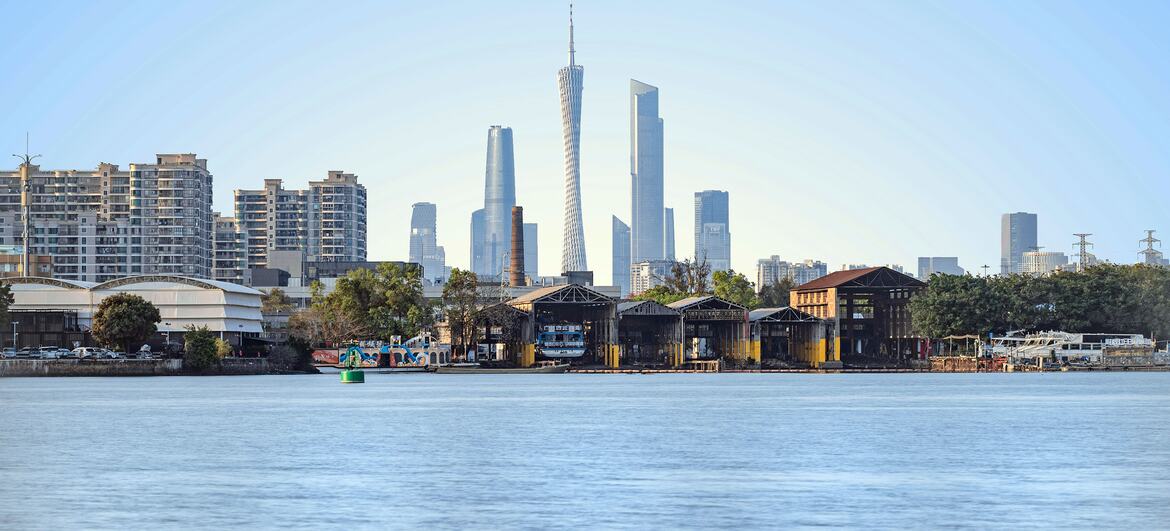 View of the Guangzhou skyline with the Canton Tower and other skyscrapers along the Pearl River.
