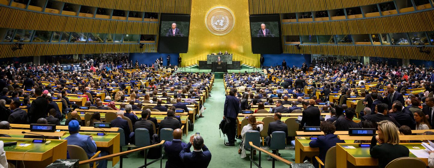 UN Secretary-General António Guterres speaks at the podium in the General Assembly Hall during the opening of the eighty-first session, with delegates seated in the audience.