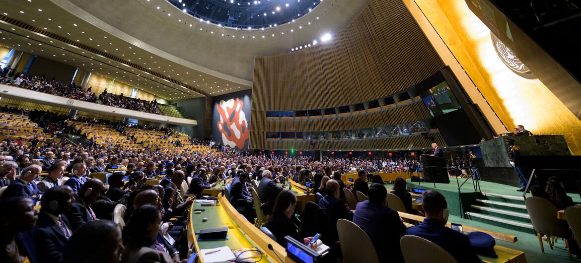 President Donald Trump speaks from the podium in the United Nations General Assembly Hall during the 81st session general debate in New York, with delegates seated in tiered rows.