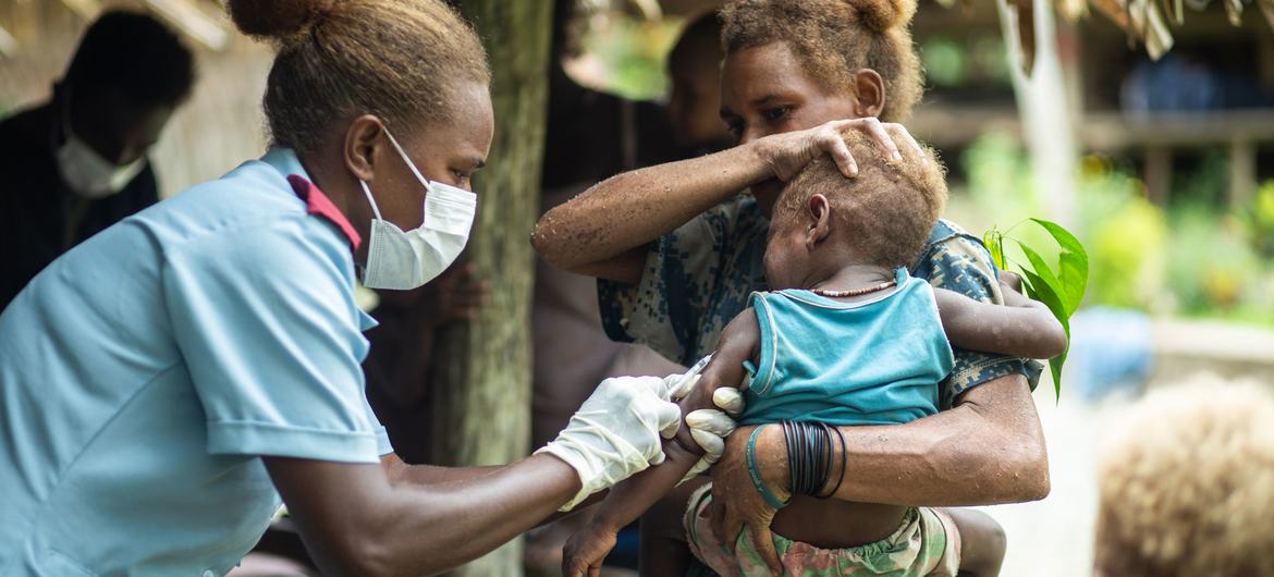 WHO and partners provide COVID-19 and other vaccines to remote communities, including in Kuvamiti in the Solomon Islands. (file)