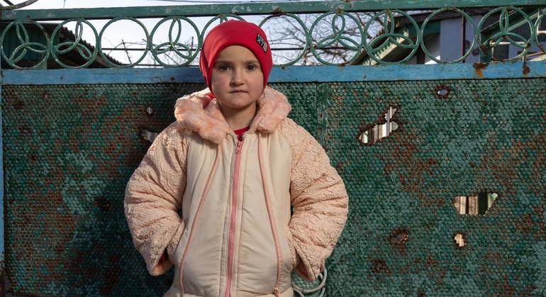 Alina, a 12 -year -old girl, in front of her collapsed house in the Macolava region. War has also had a profound impact on the kids.