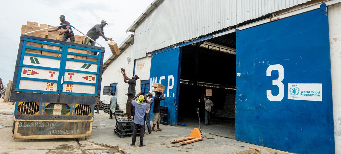 Workers offloading a food truck in World Food programme (WFP) warehouse, Maiduguri, Nigeria. (file)