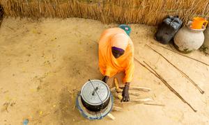 A woman cooks food in Maiduguri in northeastern Nigeria.