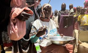 Aid is distributed in Zamzam camp in Tawila, North Darfur to people who fled their homes due to violence.