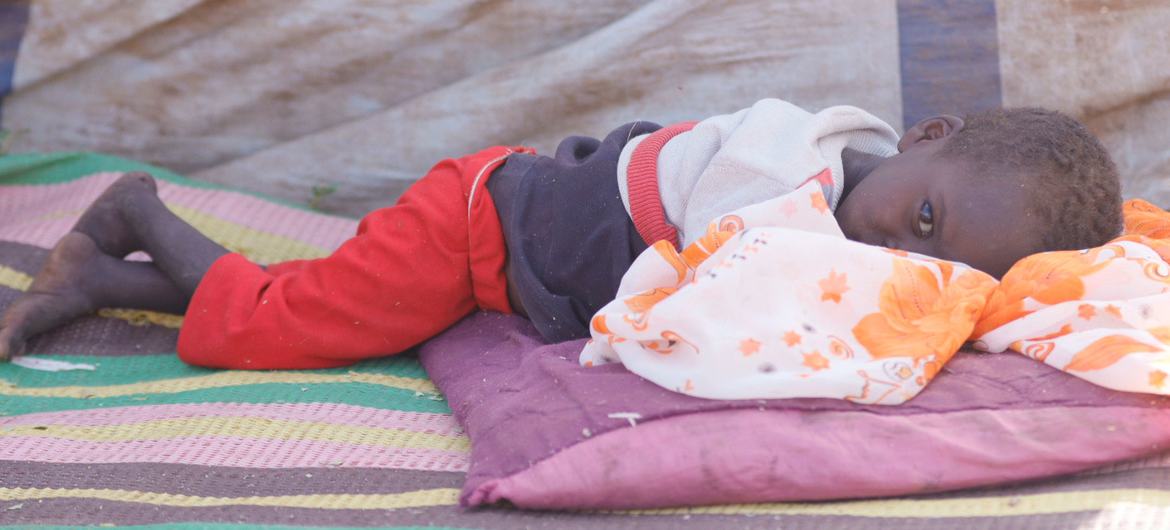 A young boy who fled El Fasher with his family rests in a camp for displaced people. (file)