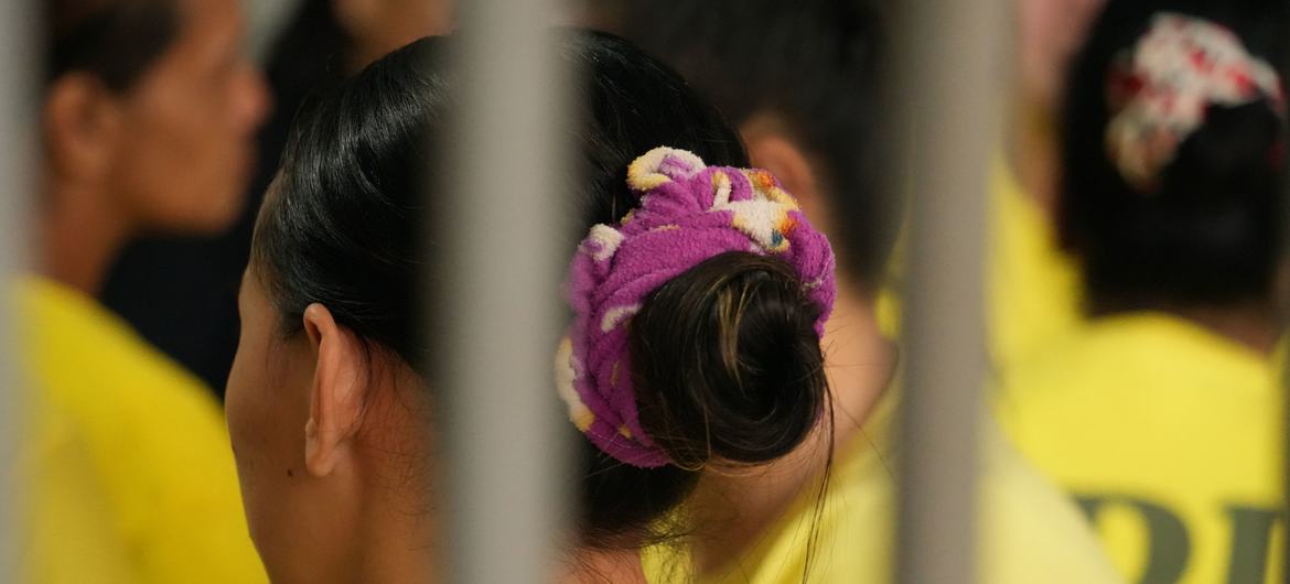 Women at the Iligan City Jail in Mindanao wear the regulation yellow PDL, Person Deprived of Liberty, T-shirt.