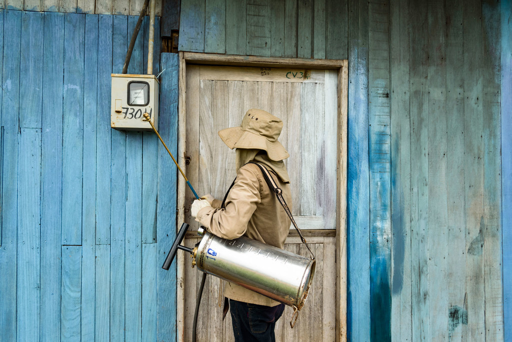 A health worker fumigates a house in Guayaramerín, Bolivia, to protect against mosquito-borne diseases.