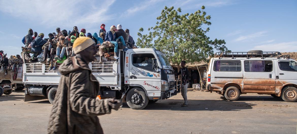 A truck full of young migrants prepare to travel to Agadez.