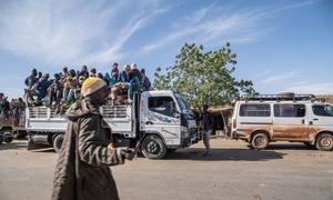 A truck full of young migrants prepare to travel to Agadez.