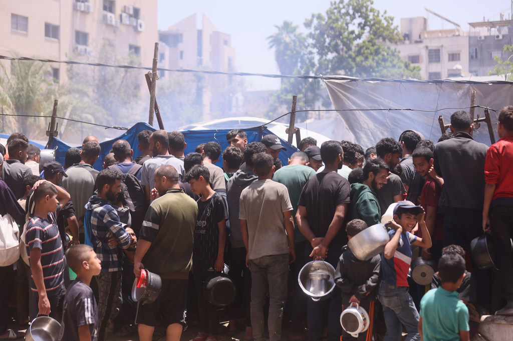 People gather at a food distribution site in Gaza.